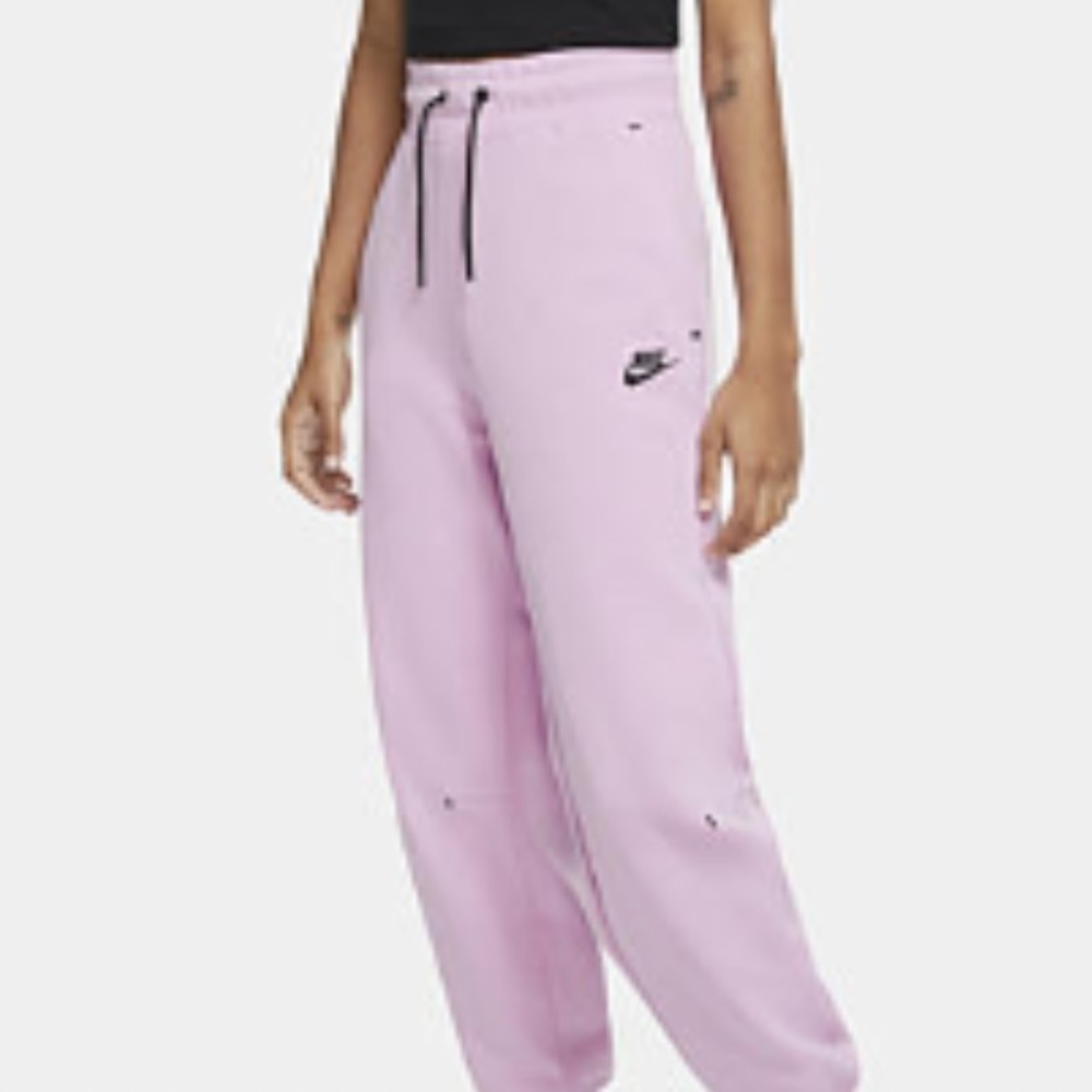 Pink Nike tech jogging pants (LIMITED EDITION WOMENS COLOR) no longer being sold